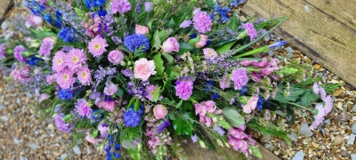 pink and blue casket spray